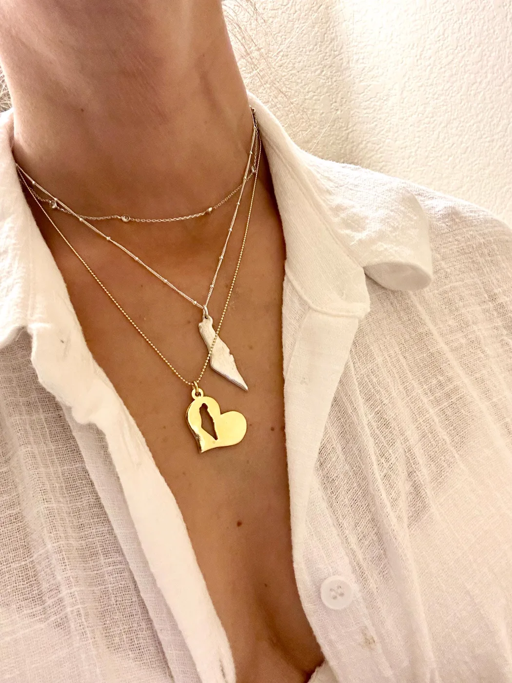 Hole in my heart necklace worn