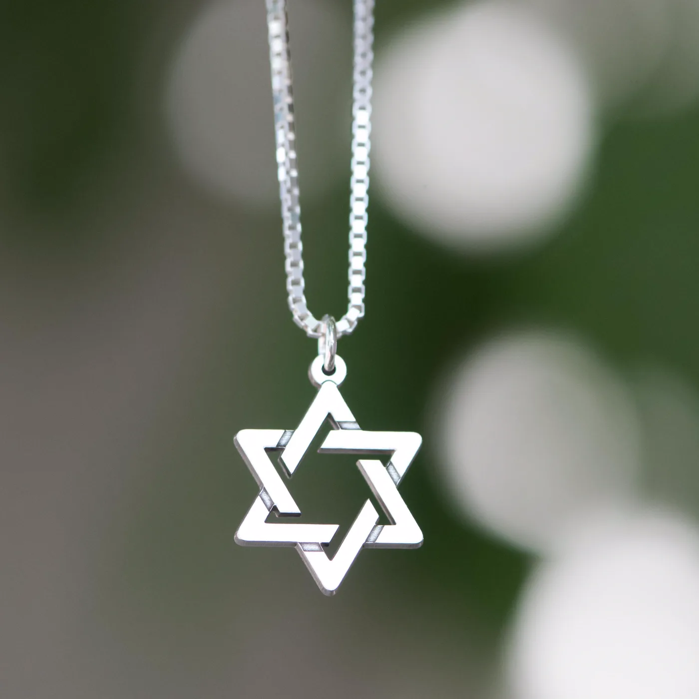 The pendant worn on a man's chest on a fine silver chain