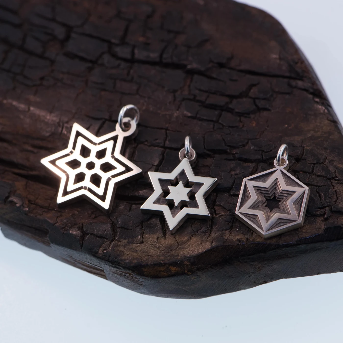 Geometric Star of David charm in sterling silver