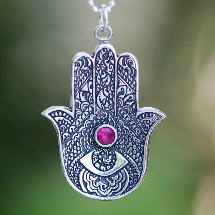Hamsa silver pendant with pink stone