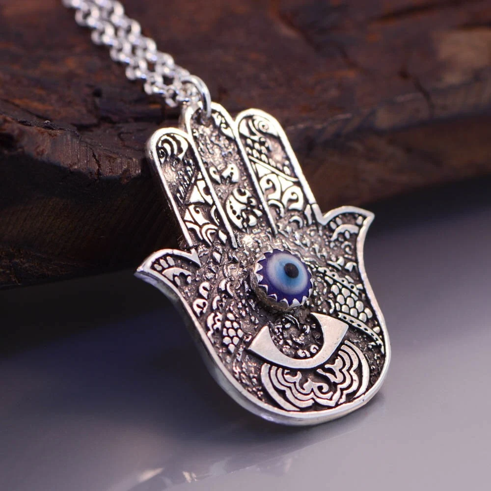 Hamsa silver pendant with evil eye